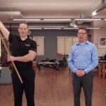 The Shoulder Stick Stretch is an exercise that can help reduce the risk of injury by improving shoulder mobility and flexibility